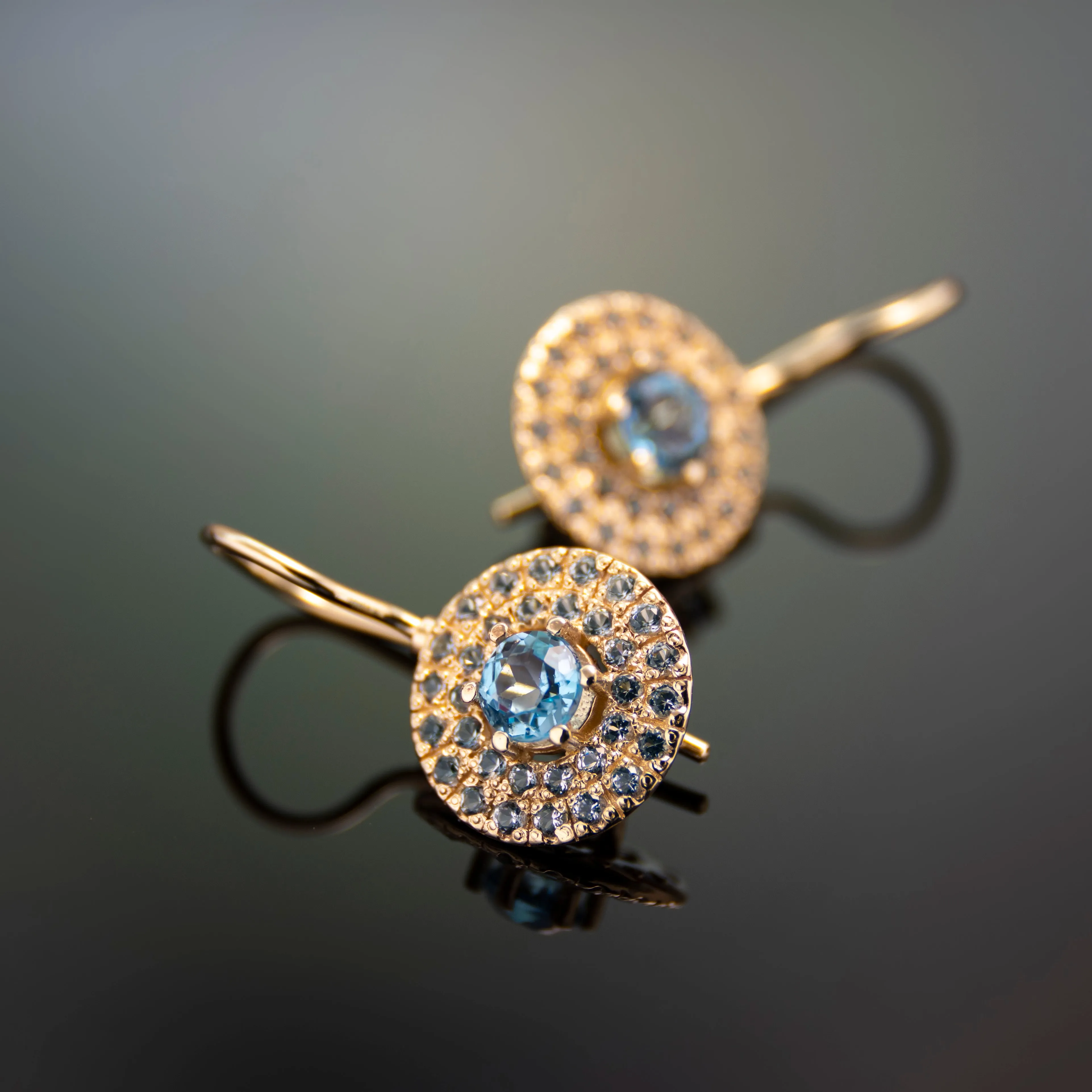 EG2245-1 Round Gold drop earrings with Blue Topaz stones set in a circle